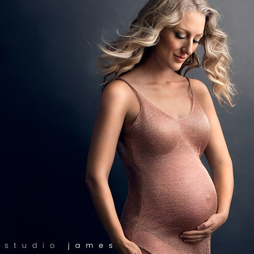 when to start wearing maternity clothes. Rose gold maternity gown.